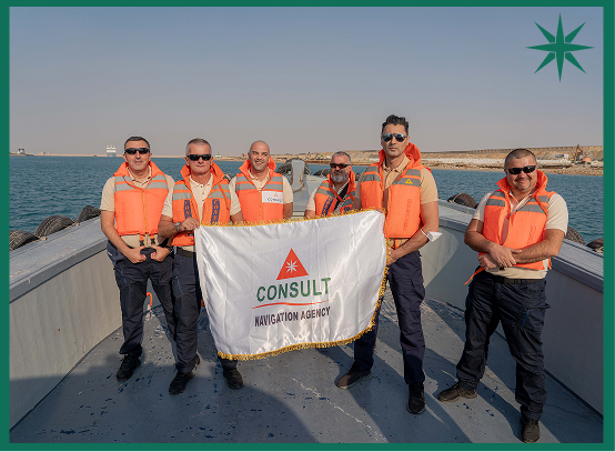 Consult Navigation team holding the company flag